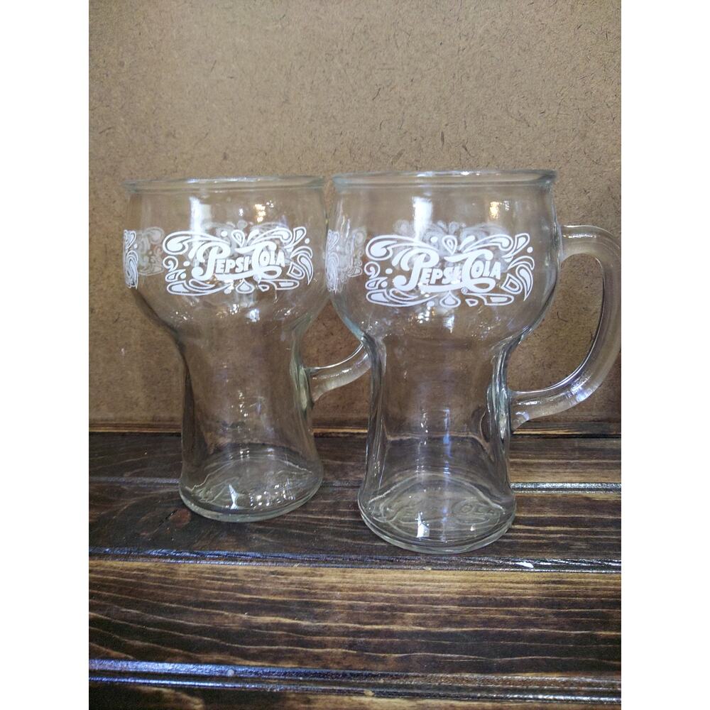Vintage 16 oz Pepsi-Cola mugs.